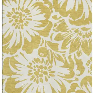 Photo of Gold And Ivory Floral Washable Area Rug With UV Protection