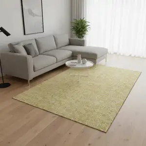 Photo of Gold And Ivory Floral Washable Area Rug With UV Protection