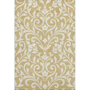 Photo of Gold And Ivory Floral Washable Area Rug With UV Protection