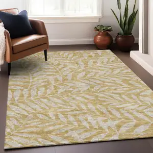 Photo of Gold And Ivory Floral Washable Area Rug With UV Protection