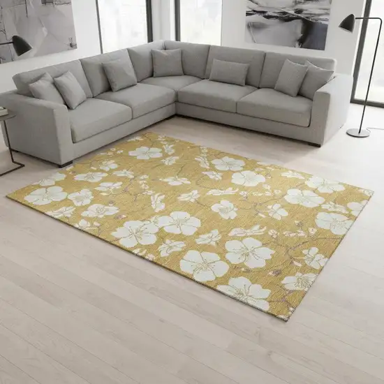 Gold And Ivory Floral Washable Area Rug With UV Protection Photo 1