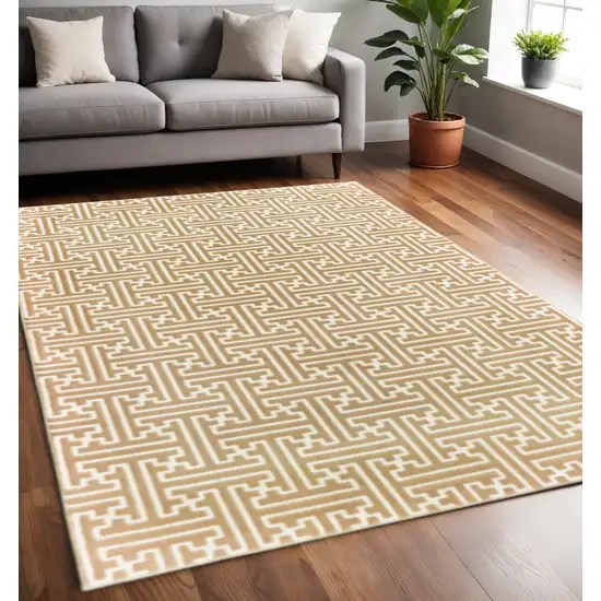 Gold And Ivory Geometric Power Loom Stain Resistant Area Rug Photo 1