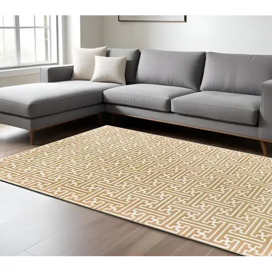Gold And Ivory Geometric Area Rug Photo 1