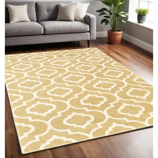 Gold And Ivory Geometric Power Loom Stain Resistant Area Rug Photo 1