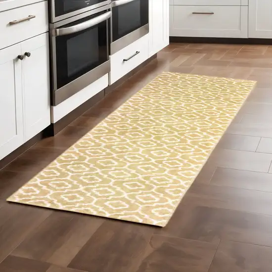 2' X 8' Gold And Ivory Geometric Power Loom Stain Resistant Runner Rug Photo 1