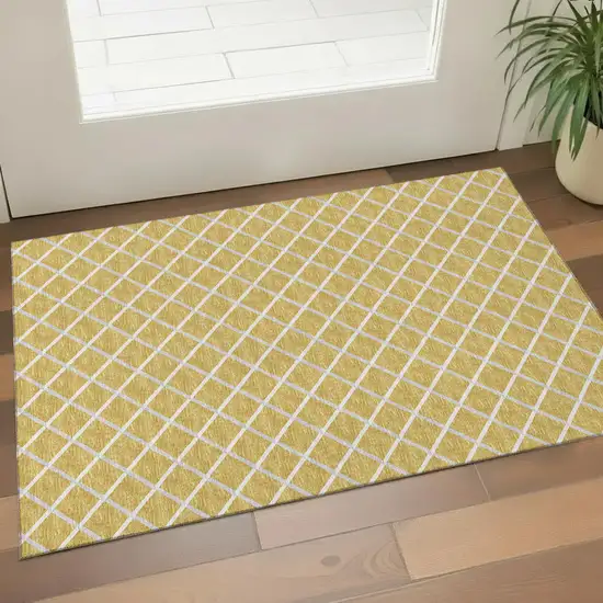 Gold And Ivory Geometric Washable Area Rug With UV Protection Photo 1