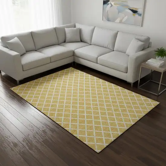 Gold And Ivory Geometric Washable Area Rug With UV Protection Photo 1