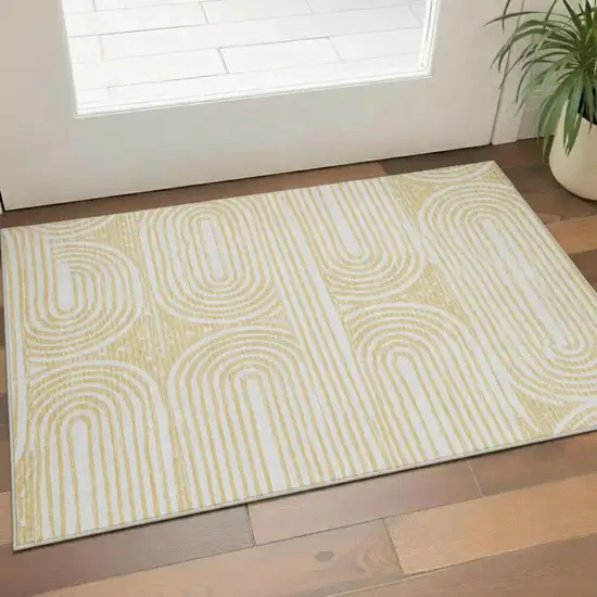 Gold And Ivory Geometric Washable Area Rug With UV Protection Photo 1