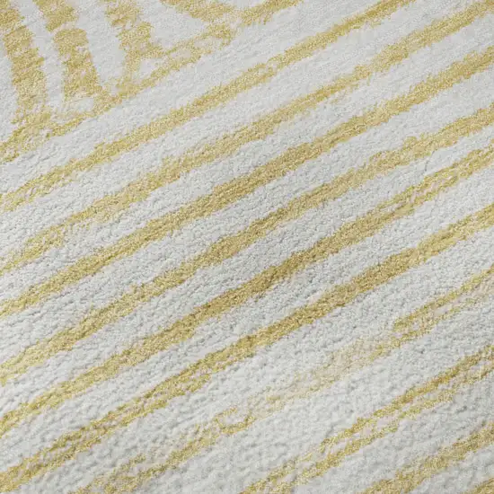 Gold And Ivory Geometric Distressed Washable Area Rug With UV Protection Photo 7