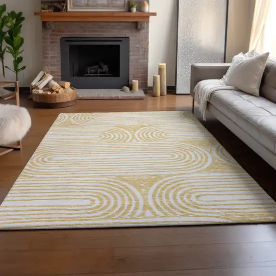 Gold And Ivory Geometric Distressed Washable Area Rug With UV Protection Photo 6