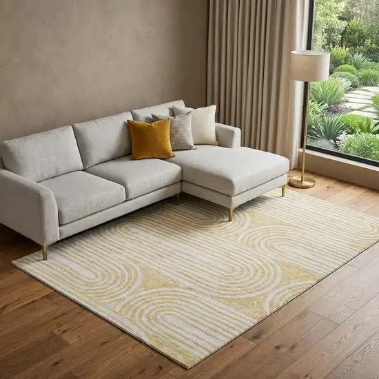 Gold And Ivory Geometric Distressed Washable Area Rug With UV Protection Photo 1