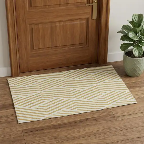 Gold And Ivory Geometric Washable Area Rug With UV Protection Photo 1
