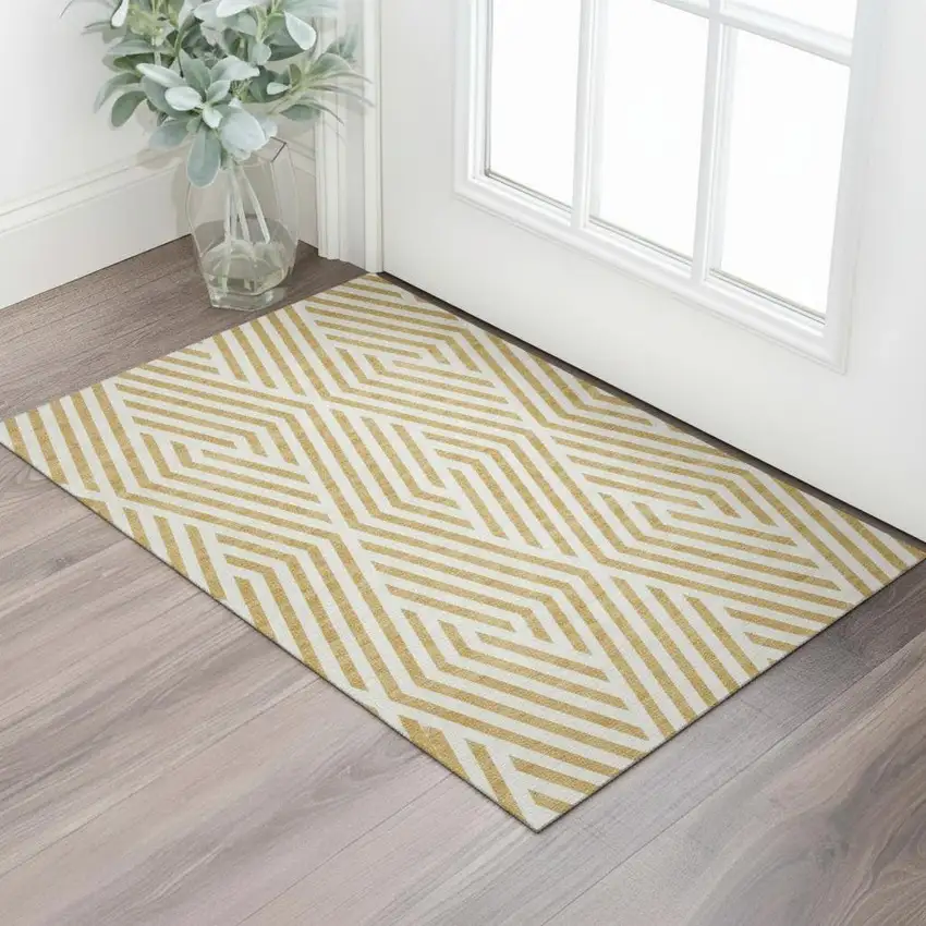 Gold And Ivory Geometric Washable Area Rug With UV Protection Photo 1