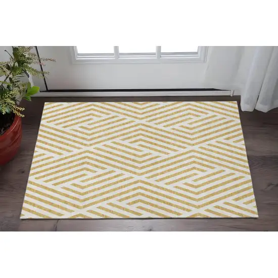 Gold And Ivory Geometric Washable Area Rug With UV Protection Photo 2
