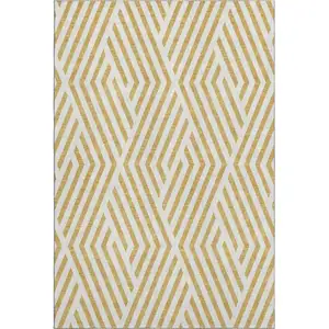 Photo of Gold And Ivory Geometric Washable Area Rug With UV Protection