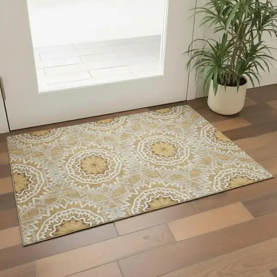Gold And Ivory Geometric Washable Area Rug With UV Protection Photo 1