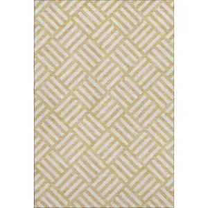 Photo of Gold And Ivory Geometric Washable Area Rug With UV Protection