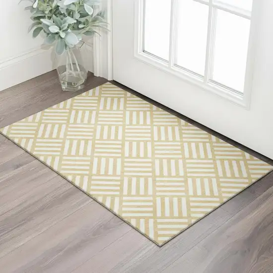 Gold And Ivory Geometric Washable Area Rug With UV Protection Photo 1