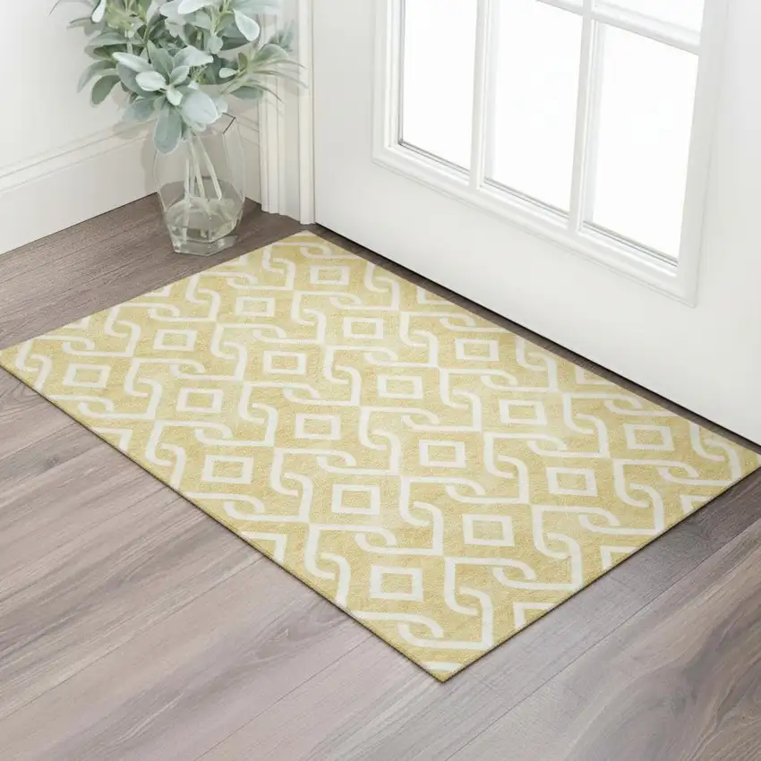 Gold And Ivory Geometric Washable Area Rug With UV Protection Photo 1