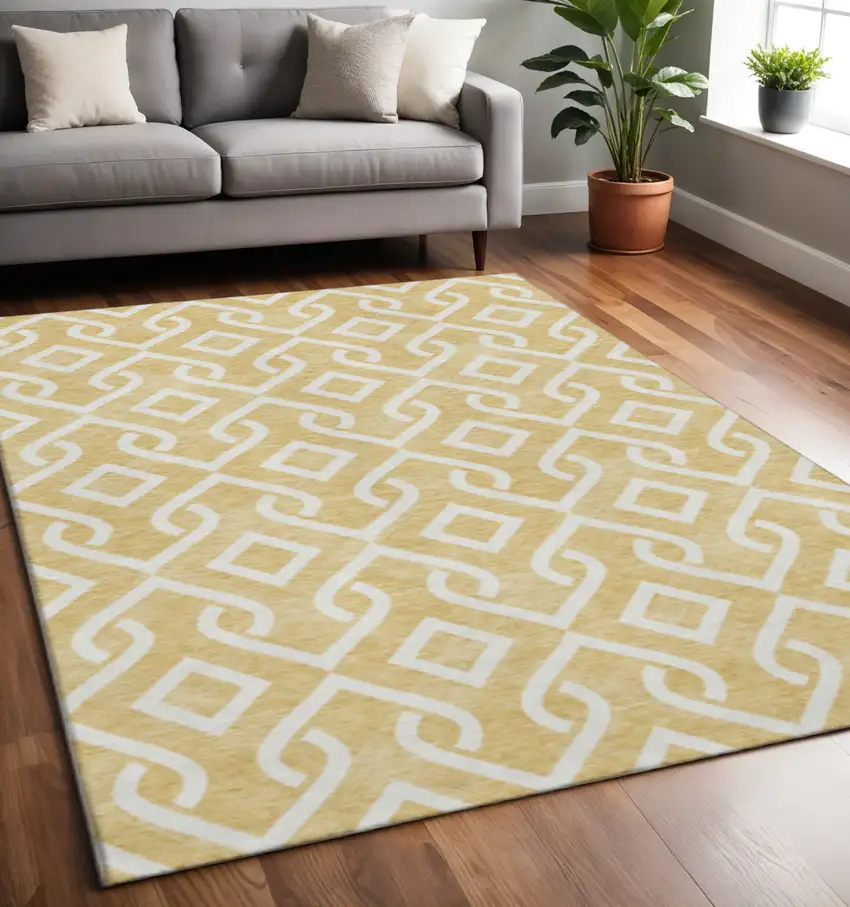 Gold And Ivory Geometric Washable Area Rug With UV Protection Photo 2