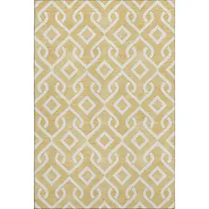 Photo of Gold And Ivory Geometric Washable Area Rug With UV Protection