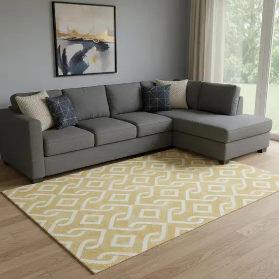 Gold And Ivory Geometric Washable Area Rug With UV Protection Photo 1