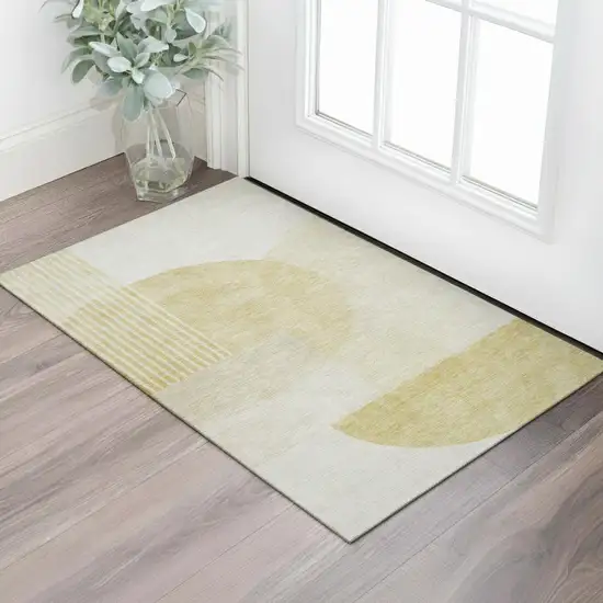Gold And Ivory Geometric Washable Area Rug With UV Protection Photo 1