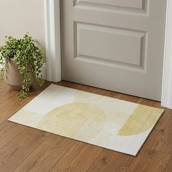 Gold And Ivory Geometric Washable Area Rug With UV Protection Photo 1