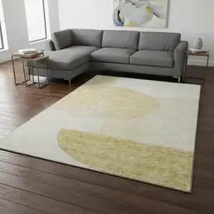 Photo of Gold And Ivory Geometric Washable Area Rug With UV Protection