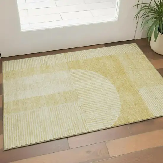 Gold And Ivory Geometric Washable Area Rug With UV Protection Photo 1
