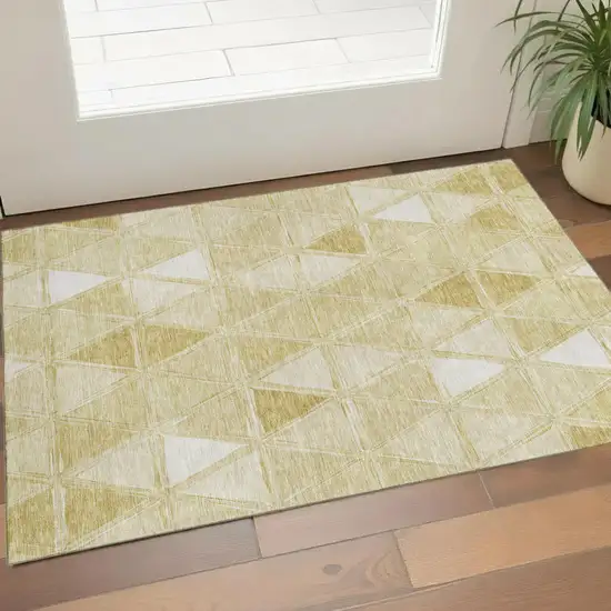 Gold And Ivory Geometric Washable Area Rug With UV Protection Photo 1
