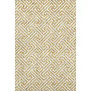 Photo of Gold And Ivory Geometric Washable Area Rug With UV Protection