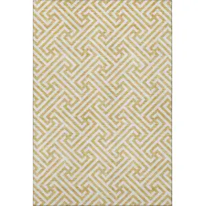 Photo of Gold And Ivory Geometric Washable Area Rug With UV Protection