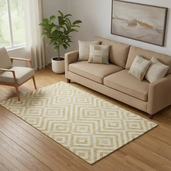 Gold And Ivory Geometric Washable Area Rug With UV Protection Photo 1