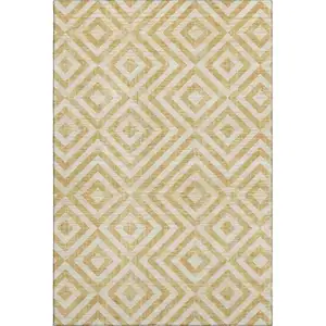 Photo of Gold And Ivory Geometric Washable Area Rug With UV Protection