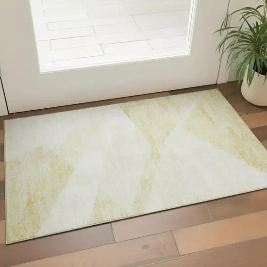 Gold And Ivory Geometric Washable Area Rug With UV Protection Photo 1