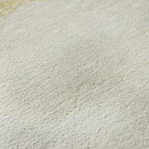 Photo of Gold And Ivory Geometric Washable Area Rug With UV Protection