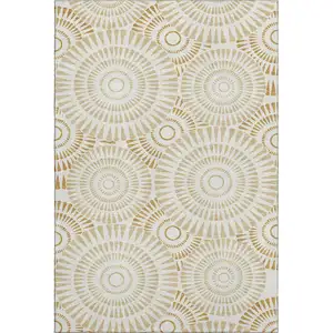 Photo of Gold And Ivory Geometric Washable Area Rug With UV Protection