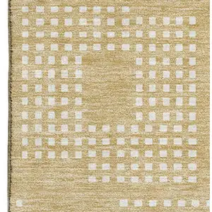 Photo of Gold And Ivory Geometric Washable Area Rug With UV Protection