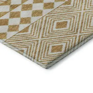 Photo of Gold And Ivory Geometric Washable Area Rug With UV Protection