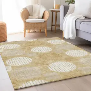 Photo of Gold And Ivory Geometric Washable Area Rug With UV Protection