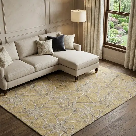 Gold And Ivory Geometric Washable Area Rug With UV Protection Photo 1