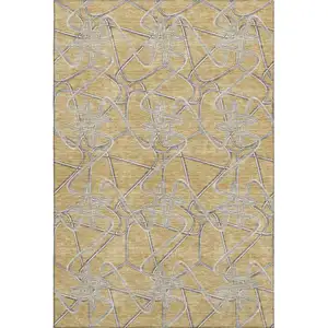 Photo of Gold And Ivory Geometric Washable Area Rug With UV Protection