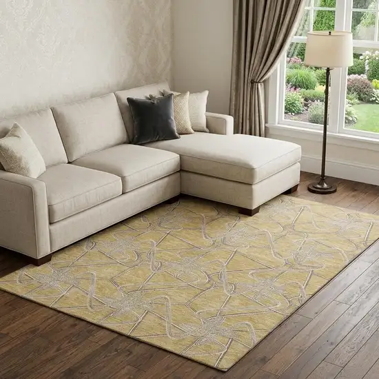 Gold And Ivory Geometric Washable Area Rug With UV Protection Photo 1