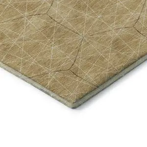 Photo of Gold And Ivory Geometric Washable Area Rug With UV Protection