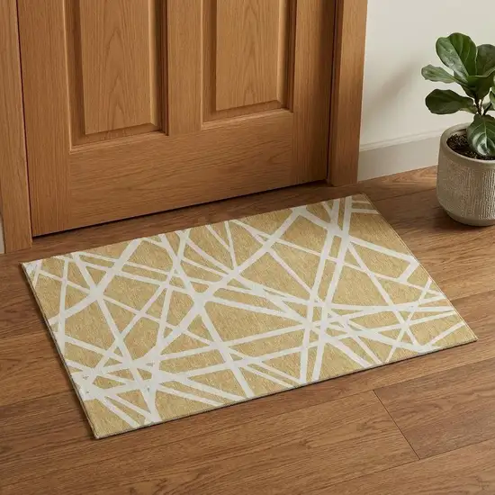 Gold And Ivory Geometric Washable Area Rug With UV Protection Photo 1