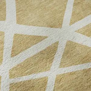 Photo of Gold And Ivory Geometric Washable Area Rug With UV Protection