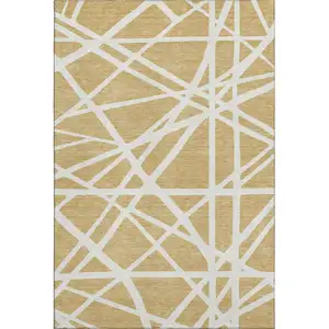 Photo of Gold And Ivory Geometric Washable Area Rug With UV Protection