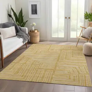 Photo of Gold And Ivory Geometric Washable Area Rug With UV Protection