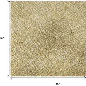 Photo of Gold And Ivory Geometric Washable Area Rug With UV Protection